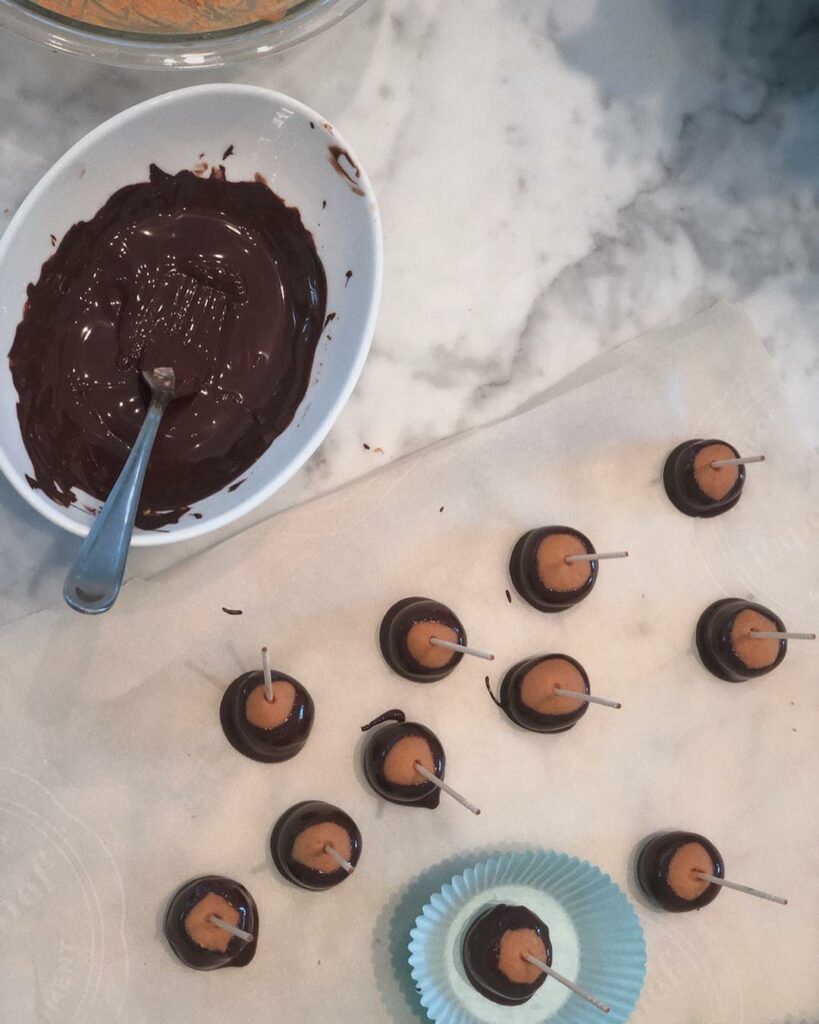 this weekend I made buckeyes for my new coworkers  because Chocolate Peanut Butt...