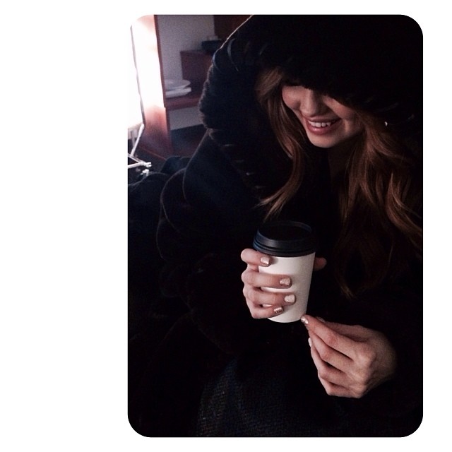 rare smile. I've created a trifecta of warm-- #fakefur #heatlamps #coffee #coffe...