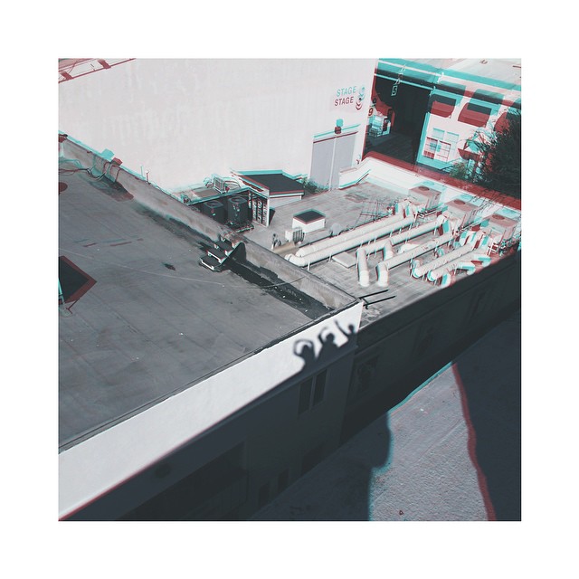 we climbed to the roof // our shadows jumped...