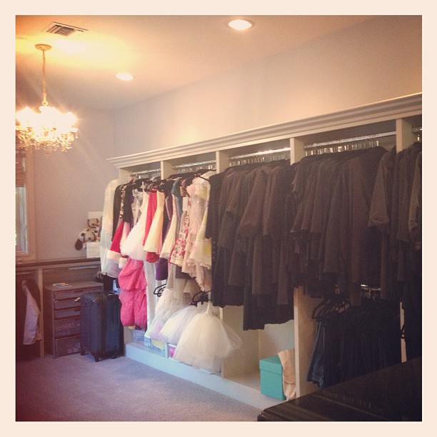 My moms wardrobe next to some of my old dresses and performance outfits. This is...