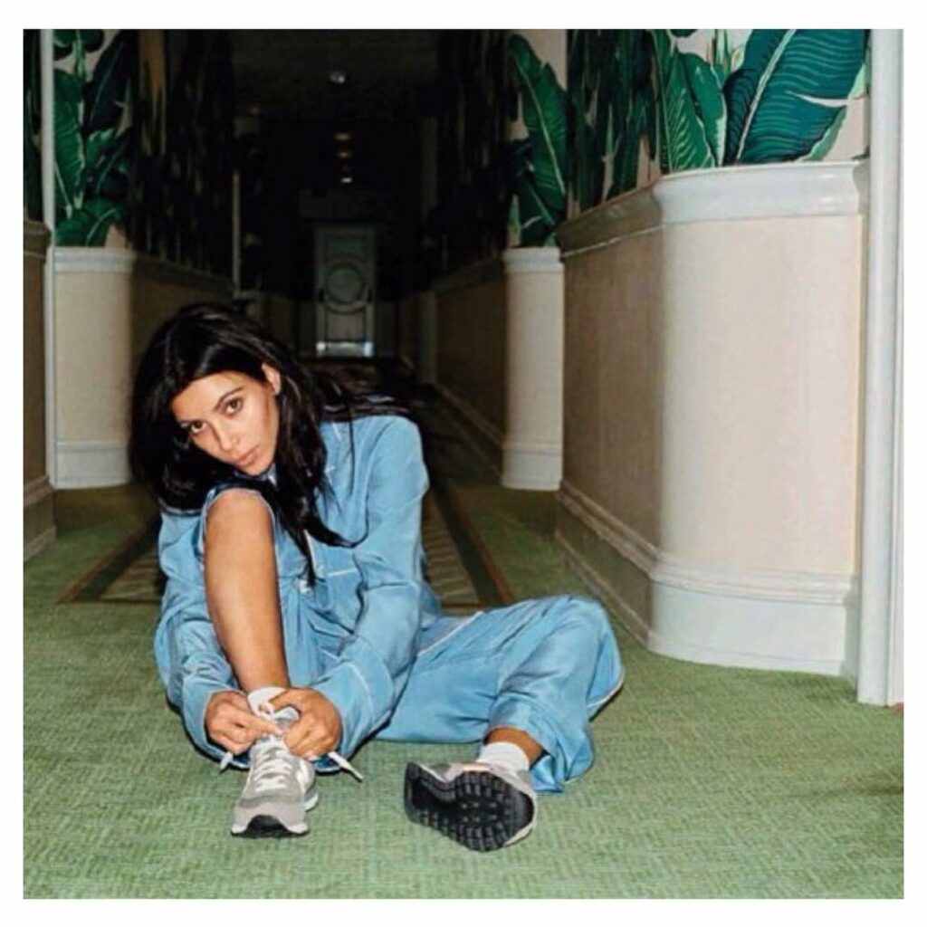 Tying my shoes in the BHH lobby #VogueSpain #KimNoFilter...