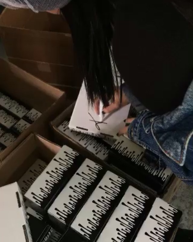 at the factory signing before packages go out  @kyliecosmetics...