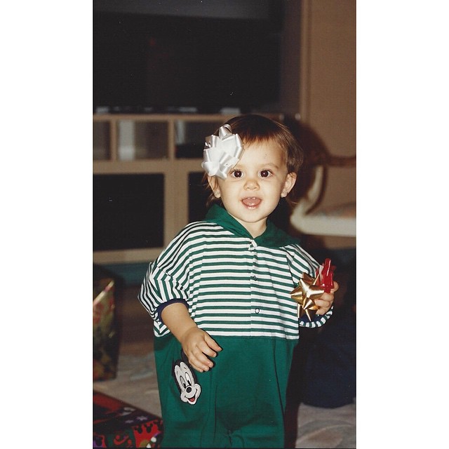 these pics are baby me collecting all of the bows from various gifts under the t...