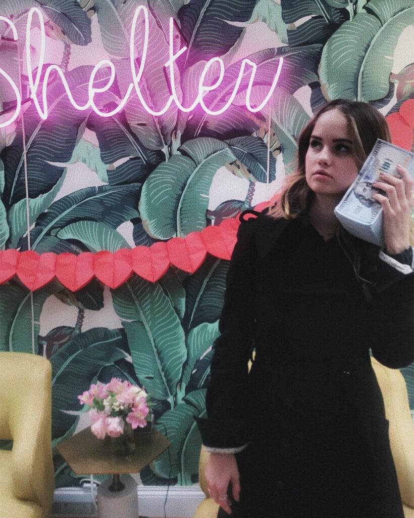 on the phone with the cash...