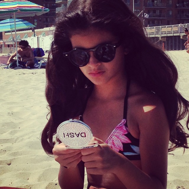 My favorite ten year old with her beach essential!...