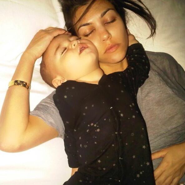 This is one of my favorite photos of life. Classic Kourt: Cartier LOVE bracelets...