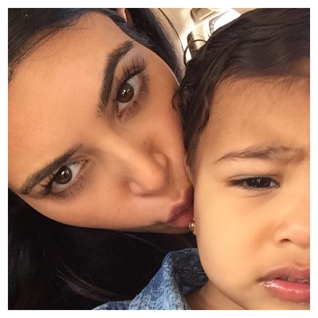 I don't know if she's annoyed with my million daily kisses or my alien face ...