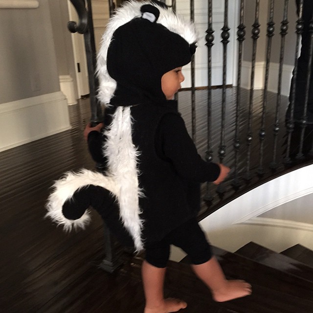 My little stinker is waiting to show daddy her costume. Halloween has started ea...