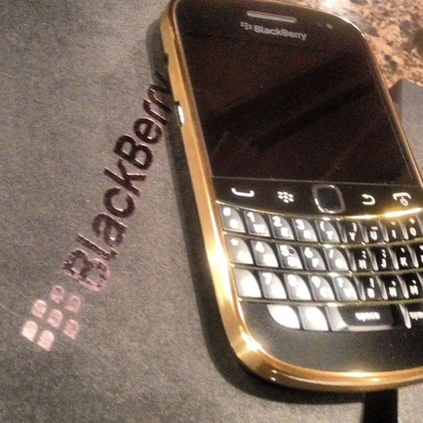 Can't sleep...setting up my new black & gold blackberry! #2phones4life...