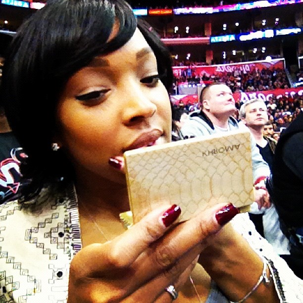 Malika at the Clipper game freshening up with her Khroma Kit...