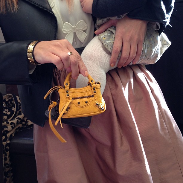 Awe Penelope is wearing the little Balenciaga bag I got her for Christmas!...