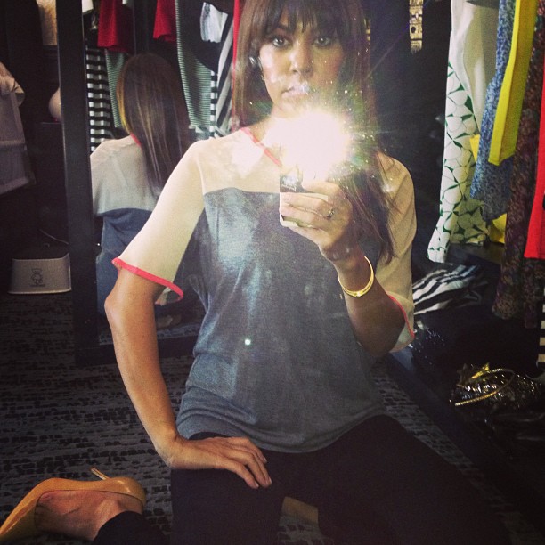 in my wardrobe getting dressed! wearing my @kardashiankollection top!...