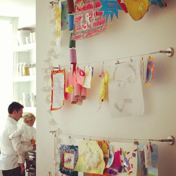 Love this idea for hanging art in the playroom!...