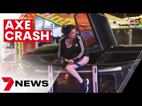 Woman threatens emergency services with an axe after crashing her car at Goodwood | 7NEWS