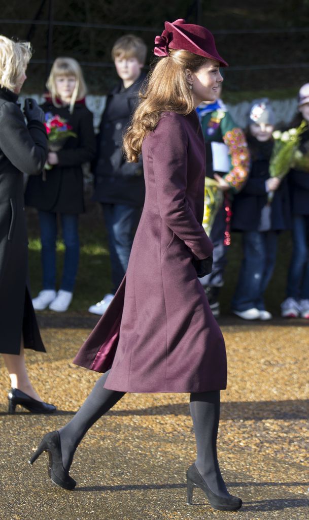 The royal wore a burgundy coat for the festive occasion