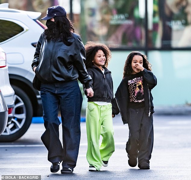 Kylie Jenner made a rare appearance in public over the weekend in her hometown of Calabasas, California. The reality TV star made the unusual move of completely covering her face with a black cloth mask from nose to neck