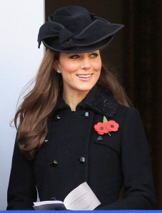 Catherine, Duchess of Cambridge sings during the Remembrance Day Ceremony 2011 wearing a Diane von Furstenberg coat, Kiki McDonough earrings, and Jane Corbett hat at the Cenotaph on November 13, 2011 in London, United Kingdom. Politicians and Royalty joined the rest of the county in honouring the war dead by gathering at the iconic memorial to lay wreaths and observe two minutes silence.
