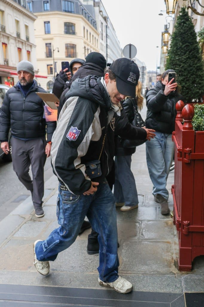 Timothée Chalamet stepped out in Paris wearing a tiny Chanel purse that got fans talking. Aissaoui Nacer / BACKGRID