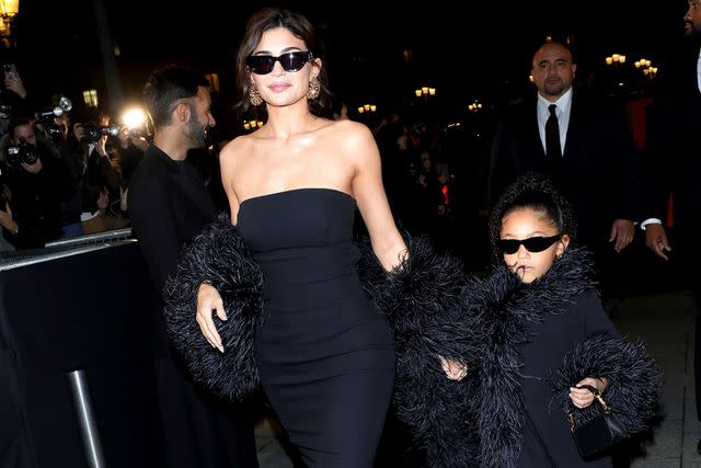 Jacopo Raule/Getty Kylie Jenner and Stormi Webster match in black dresses at the Valentino Haute Couture Spring/Summer show on Jan. 24, 2024