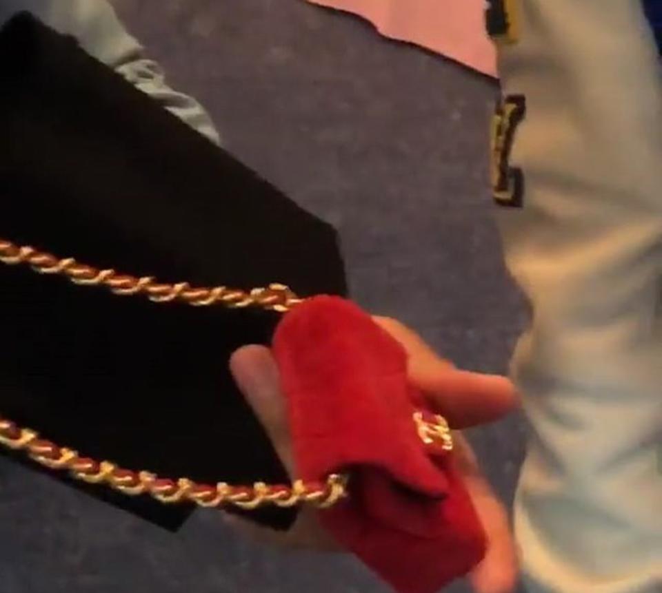 The fuzzy red flap bag is similar to Chalamet’s denim one. Instagram/@kyliejenner