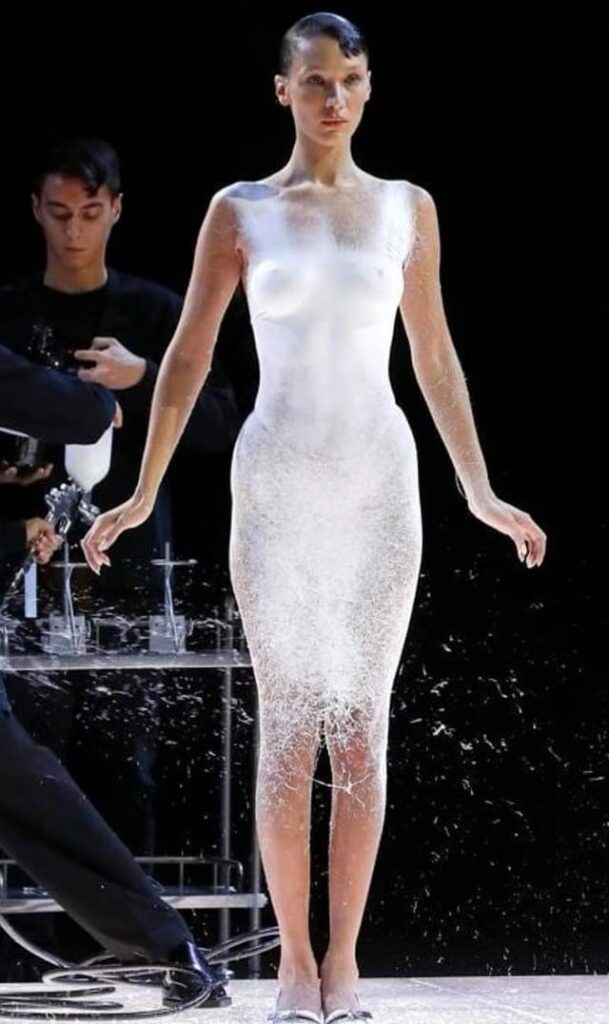 Bella Hadid with spray pained dress on runway of Paris Fashion Week, 2023