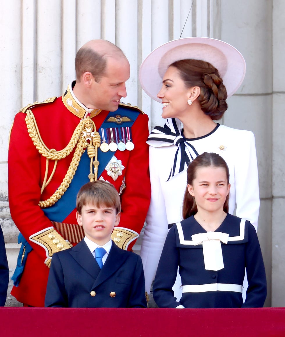 Trooping The Colour 2024 london, england june 15 l r prince george of wales, prince william, prince of wales, prince louis of wales, catherine, princess of wales and princess charlotte of wales on the balcony during trooping the colour at buckingham palace on june 15, 2024 in london, england trooping the colour is a ceremonial parade celebrating the official birthday of the british monarch the event features over 1,400 soldiers and officers, accompanied by 200 horses more than 400 musicians from ten different bands and corps of drums march and perform in perfect harmony photo by chris jacksongetty images