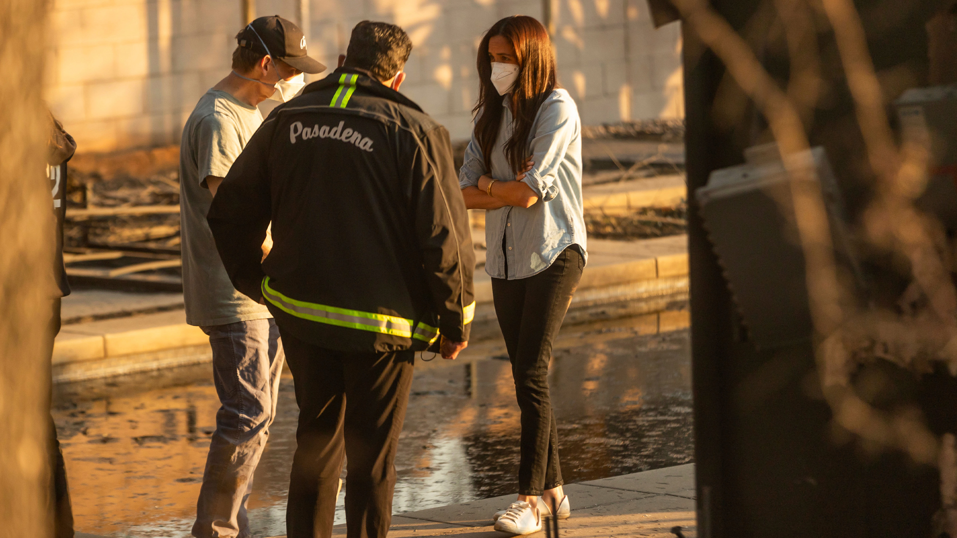 Meghan Markle, Duchess of Sussex, right, speaks with Pasadena Mayor Victor Gordo, center, and Doug Goodwin, who's home was destroyed by the Eaton Fire, in Altadena, Calif., Friday, Jan. 10, 2025.