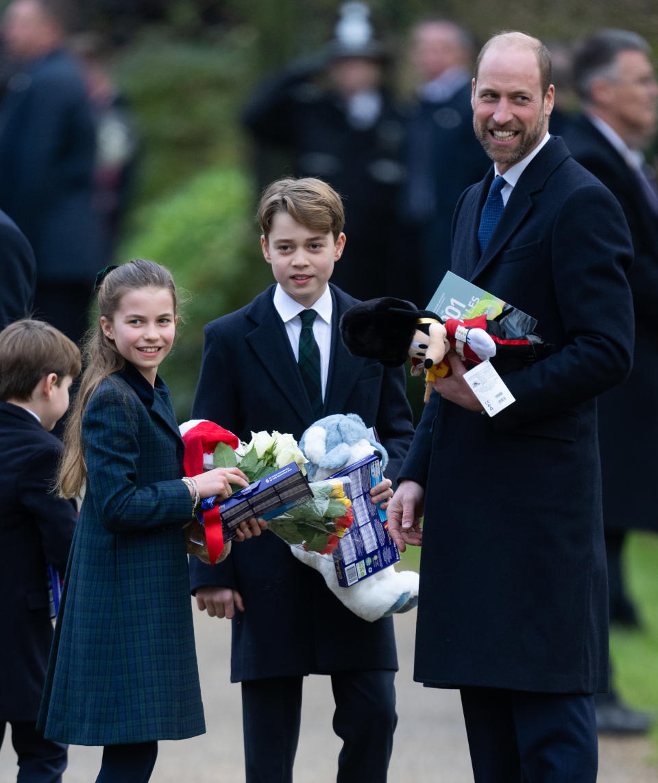 Prince William smiling with Prince George, Princess Charlotte and Prince Louis in dark coats and ties on Christmas day