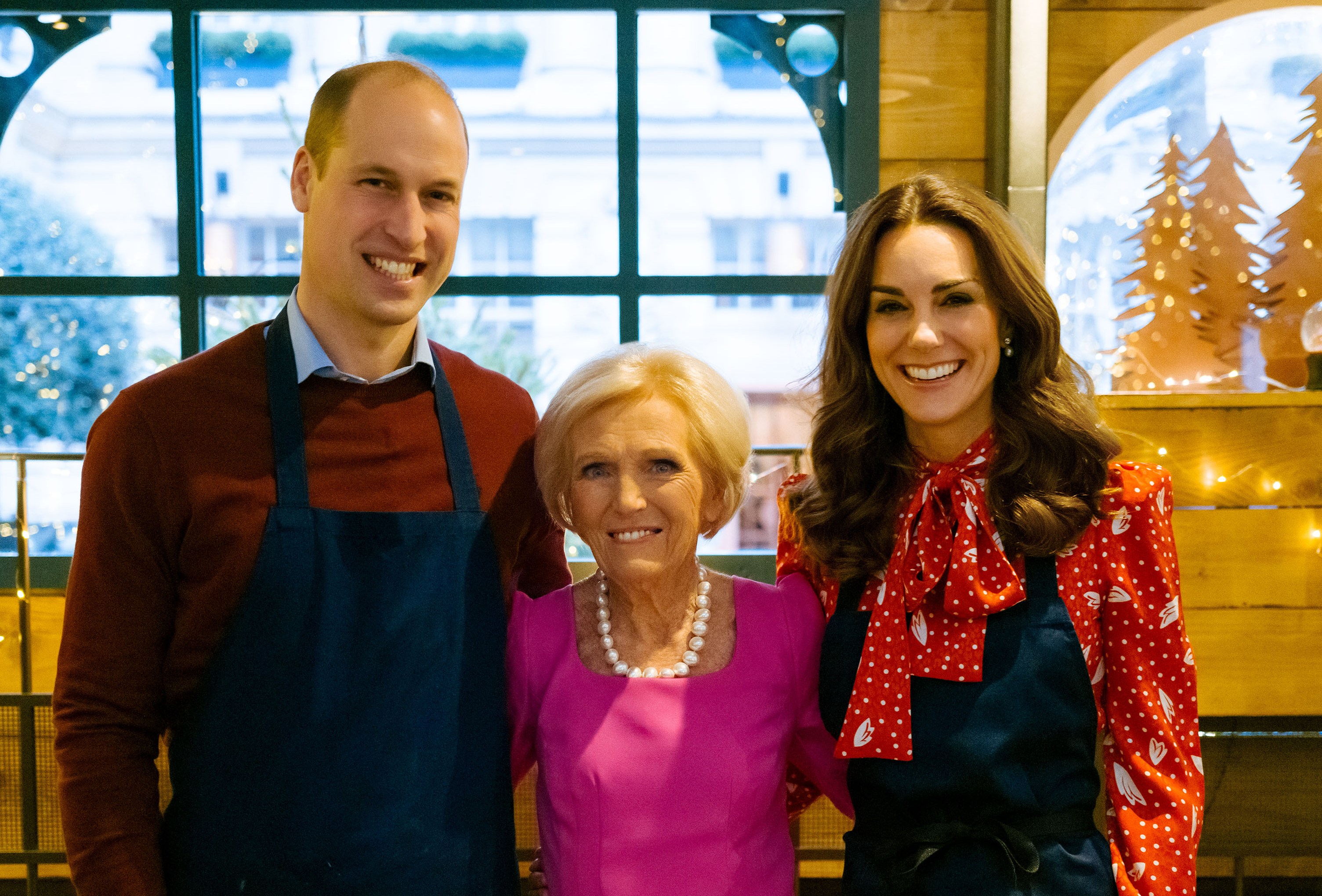 The Duke and Duchess of Cambridge and Mary Berry baking together in a winter chalet.