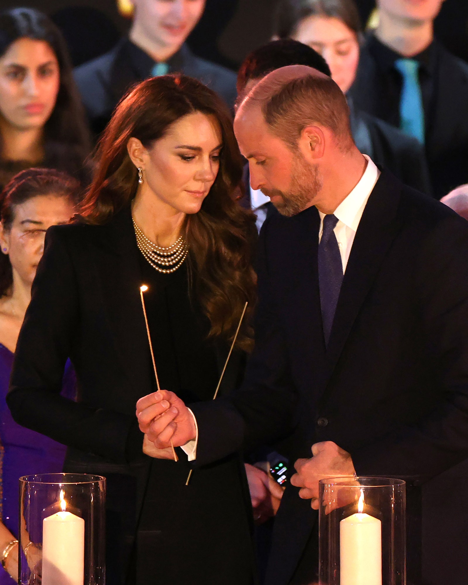 Catherine Princess of Wales and Prince William Prince of Wales light candles at the Holocaust Memorial Day London