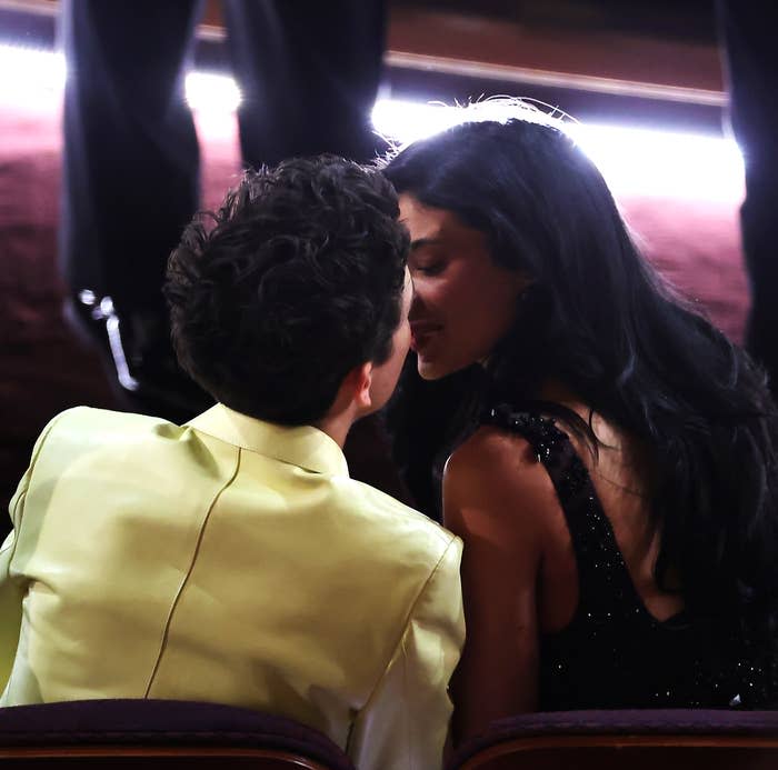 Timothée Chalamet and Kylie Jenner lean in for a kiss while sitting front row at the oscars