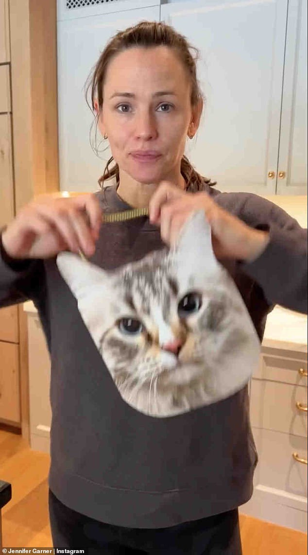 Jennifer Garner shared a delightful video of herself wearing a mask of her cat Moose's face last year