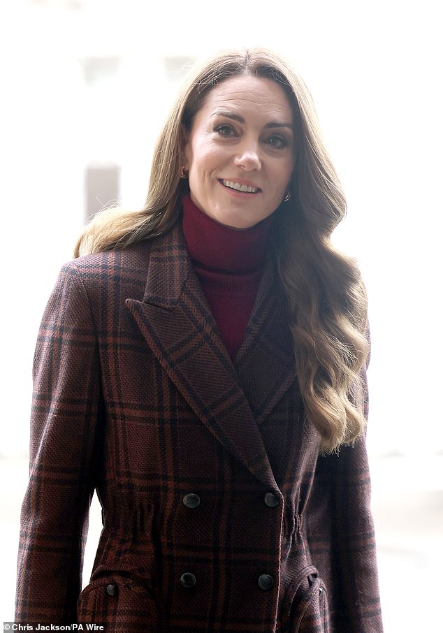 At her first public appearance of 2025 at the Royal Marsden Hospital, Catherine looked understated but by no means less elegant, wearing a long tailored coat from Blazé Milano with a burgundy skirt by Edeline Lee. The bespoke maroon tartan coat with double breasted finish, nipped in at the waist, was accentuated further by the structure in the shoulders