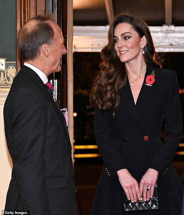 Dressed head-to-toe in black with a poppy adorning her coat dress, Kate looked dignified in her sombre ensemble as she paid her respects at the Festival of Remembrance. The sharp shoulders gave the ensemble a commanding presence