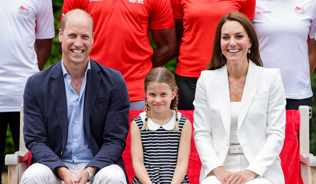 Britain's Princess Charlotte of Cambridge (C), Britain's Prince William, Duke of Cambridge (L) and Britain's Catherine, Duchess of Cambridge (R) pose for a photograph during a visit to SportsAid House on day five of the Commonwealth Games in Birmingham, central England. Pic: Getty Images