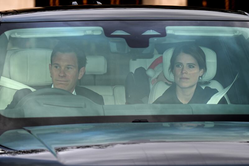 Princess Eugenie and Jack Brooksbank arrive for King Charles’ Christmas lunch at Buckingham Palace with a sleeping August in the backseat.