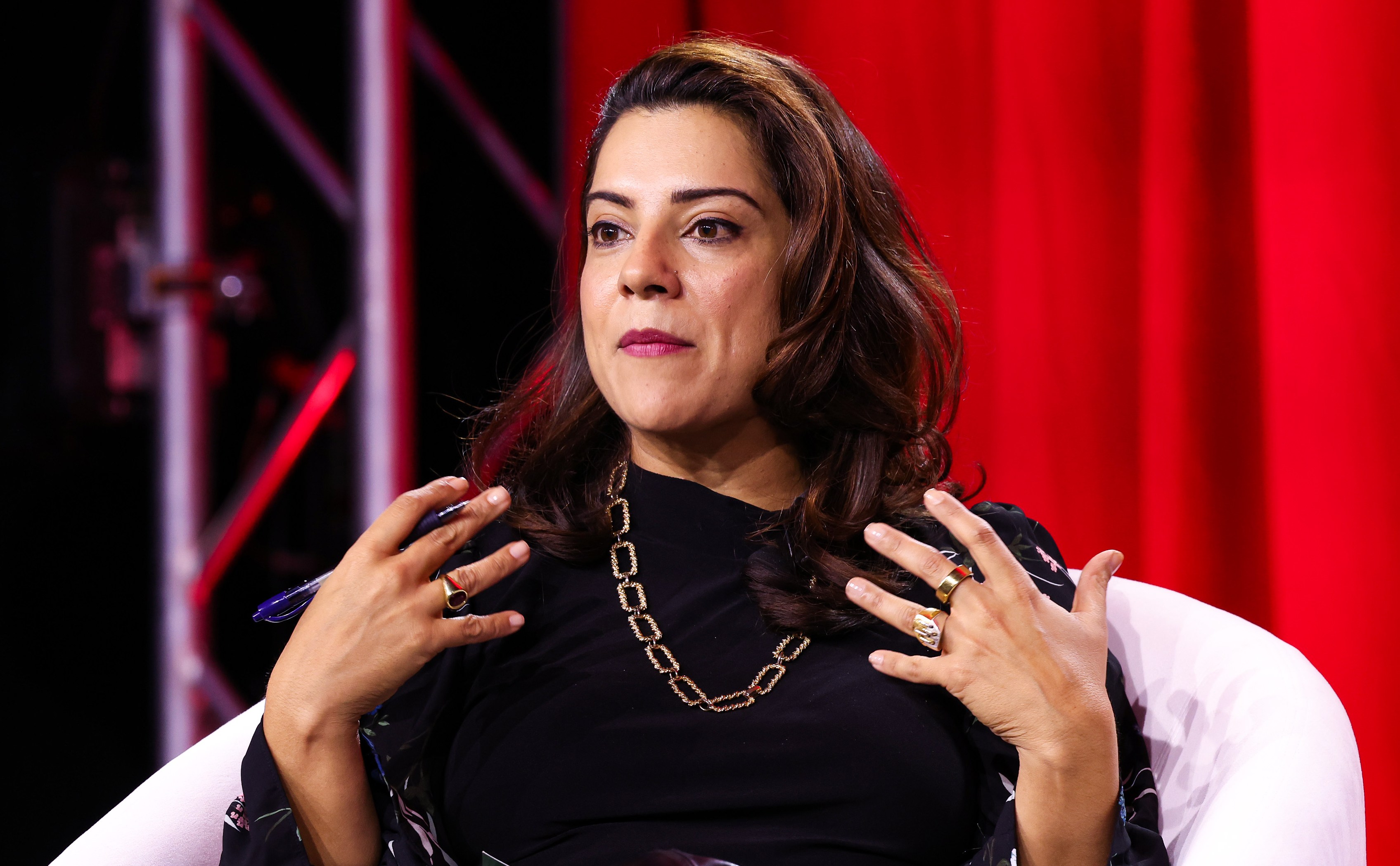 Reshma Saujani speaking onstage at CareFest.