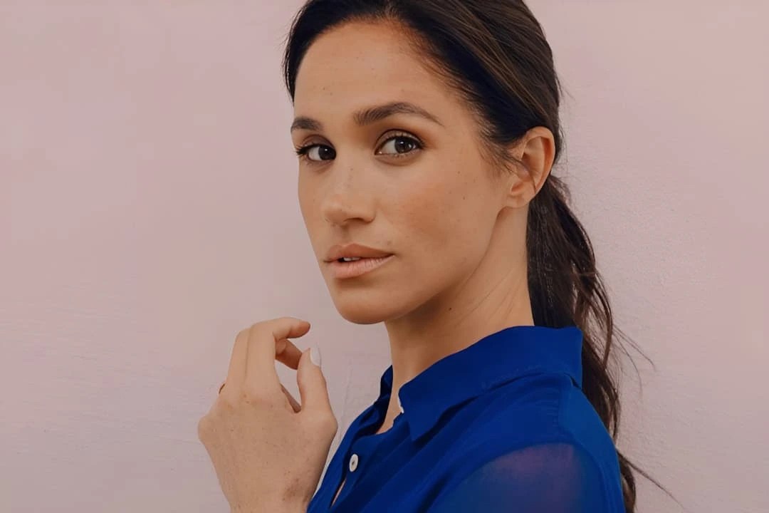 Meghan Markle in a blue shirt.