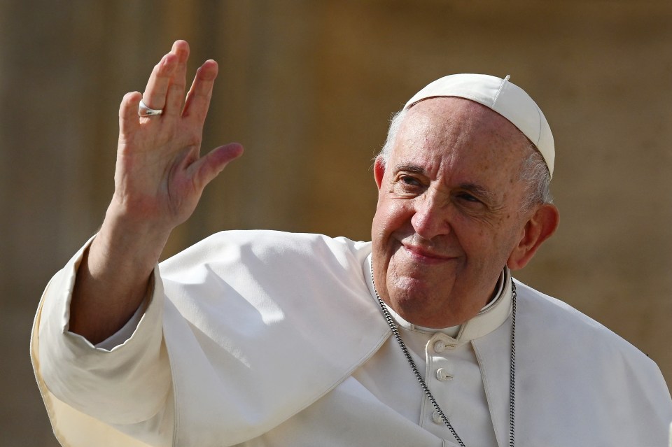 Pope Francis waving.