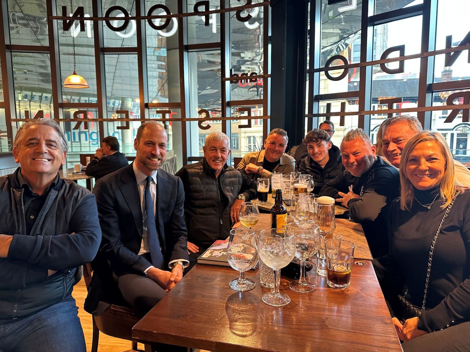 Prince William gets a round in for Aston Villa fans in a Birmingham Wetherspoons