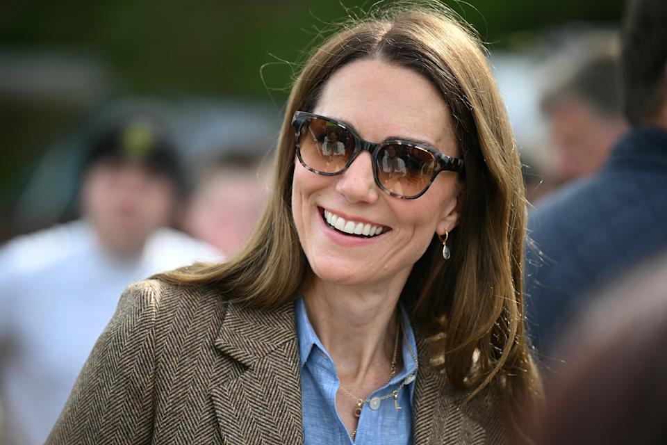 TOBERMORY, SCOTLAND - APRIL 29: Catherine, Princess of Wales reacts as she meets with stall holders during a tour of an artisan market on April 29, 2025 in Tobermory, Scotland. The Prince and Princess of Wales are on a two-day visit to the Isles of Mull and Iona on the 29th and 30th of April to engage with rural island communities. During their time on the islands, they will connect with local residents, highlighting the value of social bonds and underscoring the importance of safeguarding and advocating for the natural environment. (Photo by Oli Scarff - WPA Pool/Getty Images)