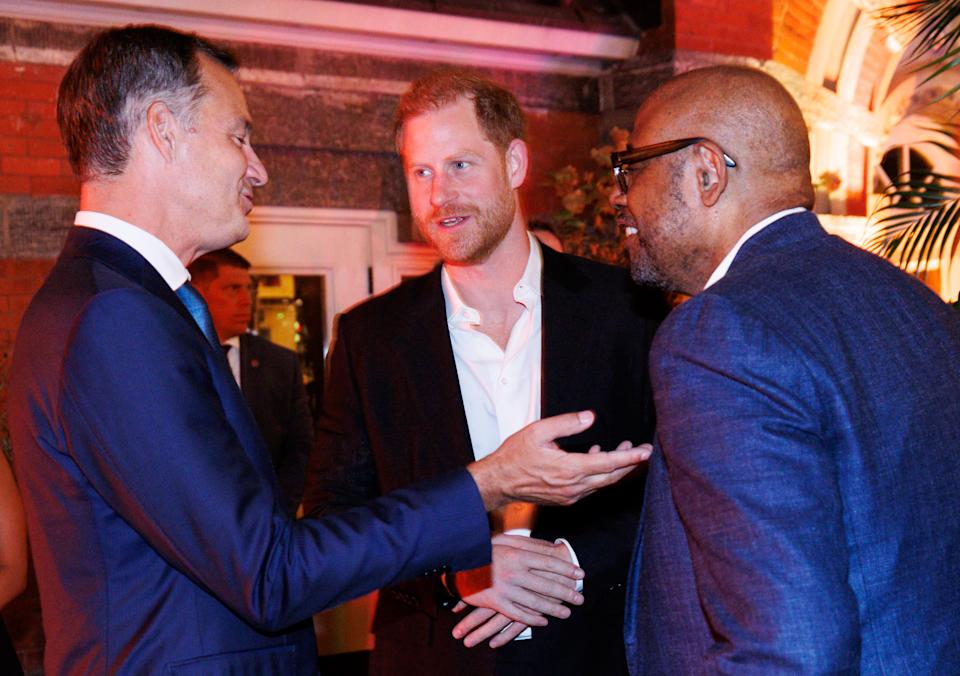 Harry, pictured with actor Forest Whitaker and outgoing Belgian prime minister Alexander de Croo, attended a WHO dinner alone (Shutterstock)