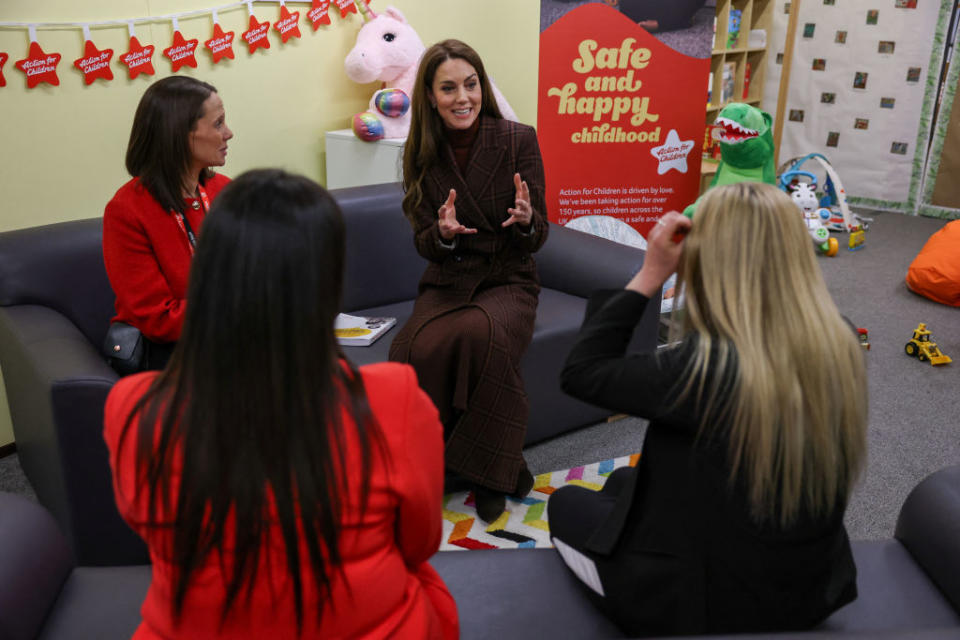Catherine, Princess of Wales visits HMP Styal on Feb. 11 in Cheshire, England, tartan coat, Blaze Milano, burgundy