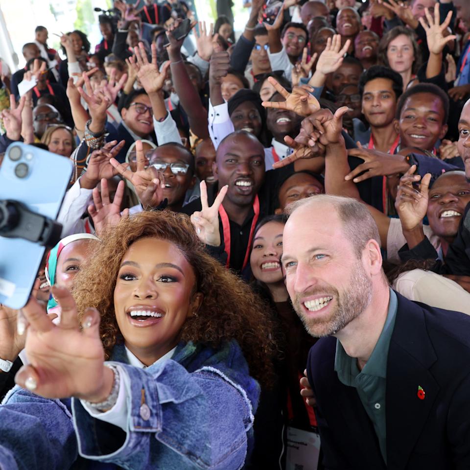  Prince William taking selfies with fans. 