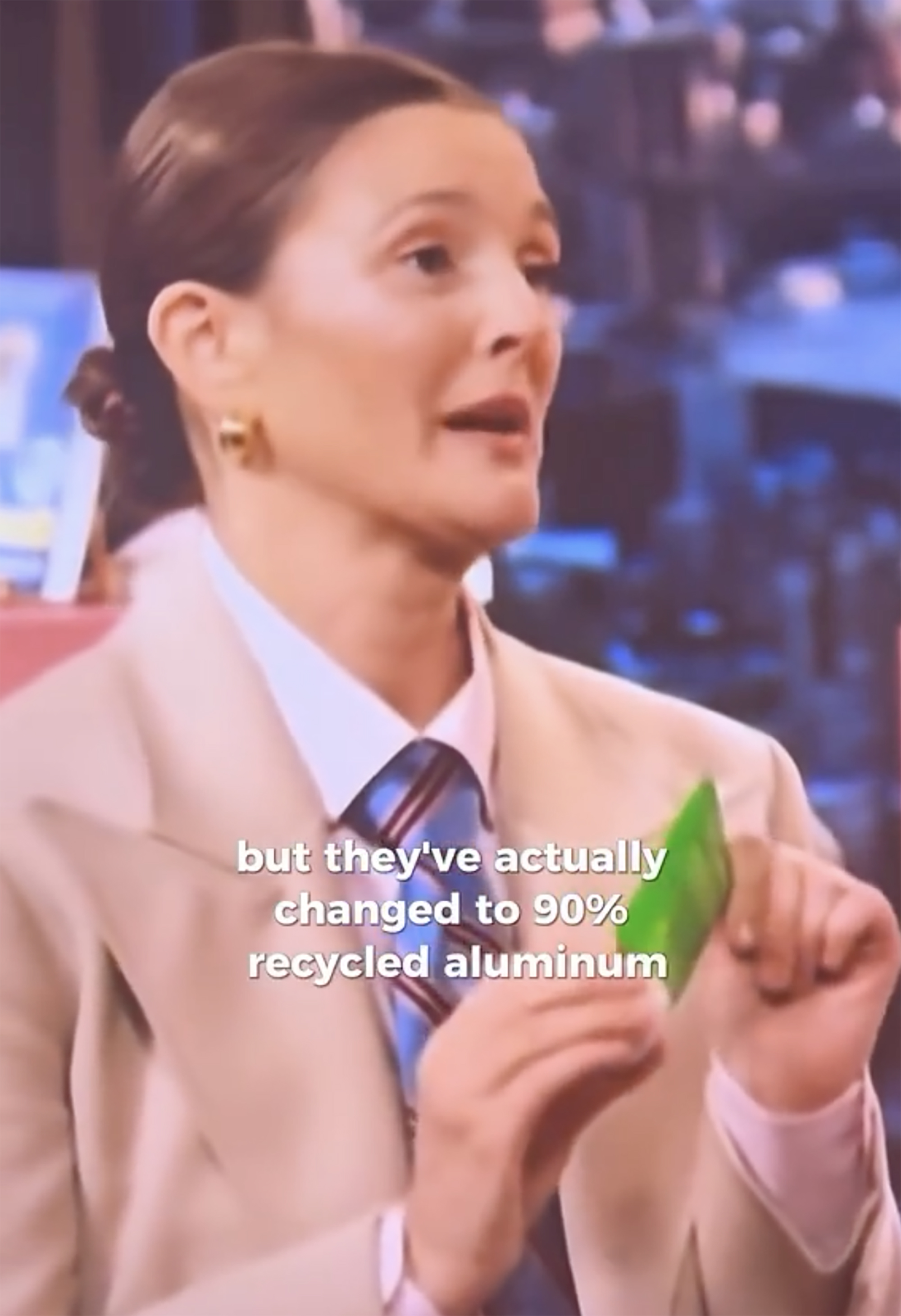 Drew Barrymore holding a Weleda bottle