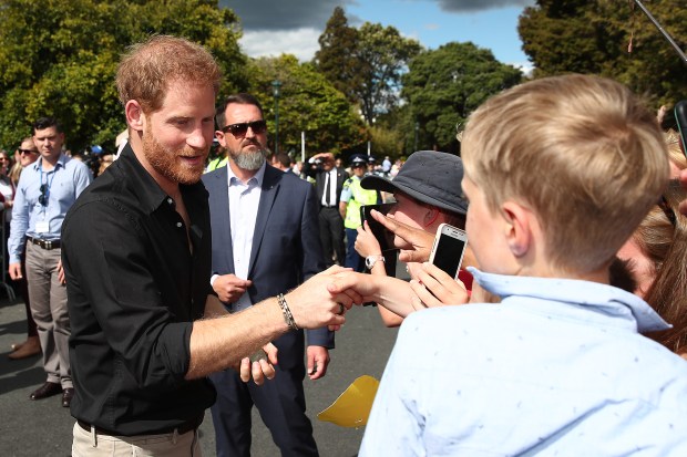 Prince Harry, Duke of Sussex, left, and Meghan, Duchess of...