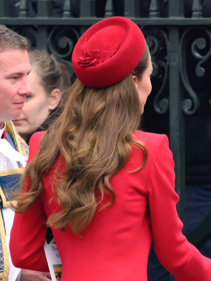 Catherine, Princess of Wales, departing in a red coat and hat.