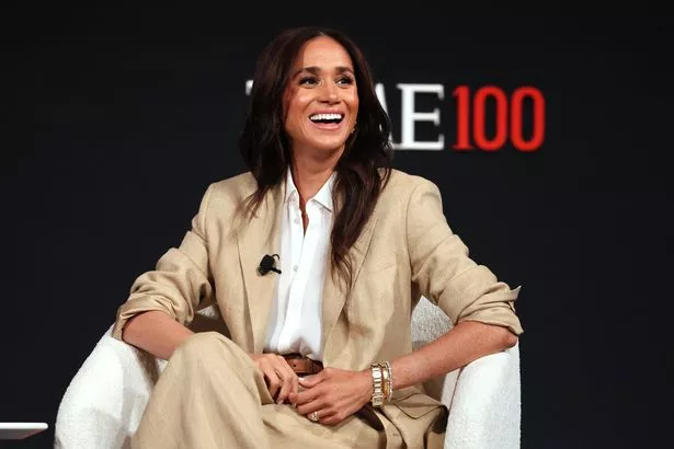Meghan speaks on stage at the summit 