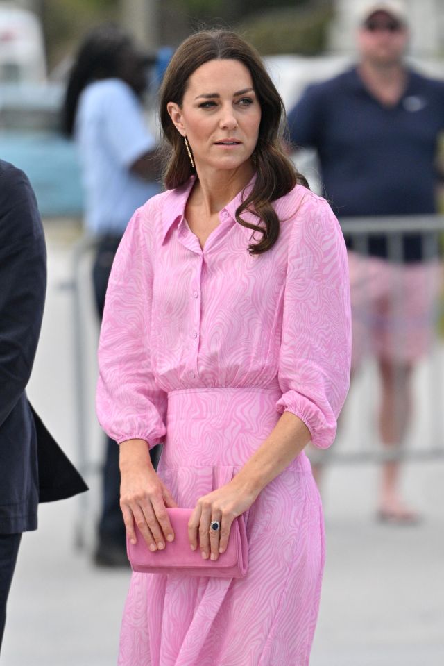 Catherine, Duchess of Cambridge, in a pink dress and clutch.