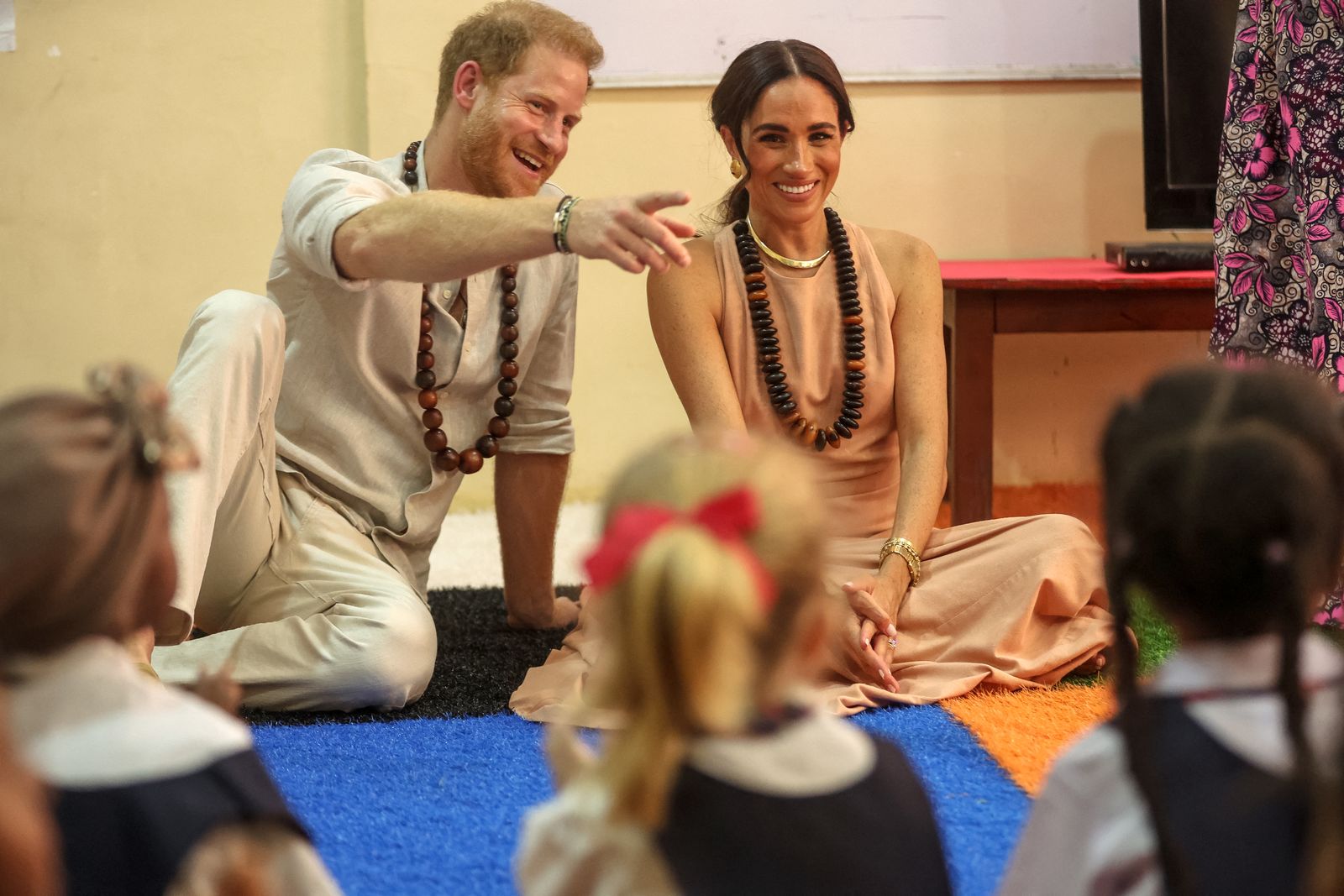 Image may contain Prince Harry Duke of Sussex Meghan Duchess of Sussex Adult Person Accessories Jewelry and Necklace